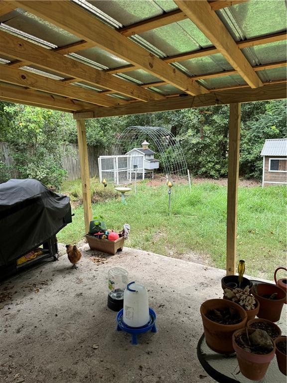 exterior space featuring an outbuilding and a patio