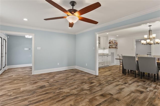 dining area featuring ornamental molding, dark wood finished floors, and baseboards