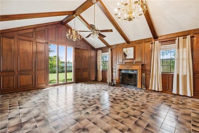 unfurnished living room with wood walls, a wealth of natural light, a premium fireplace, and tile patterned flooring