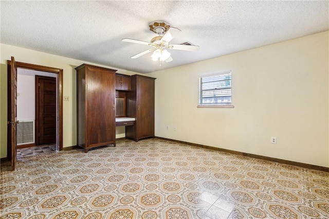 unfurnished bedroom featuring a textured ceiling, ceiling fan, and light tile patterned floors