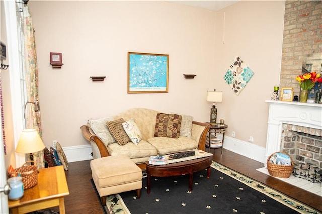 living room featuring a fireplace and dark wood-type flooring