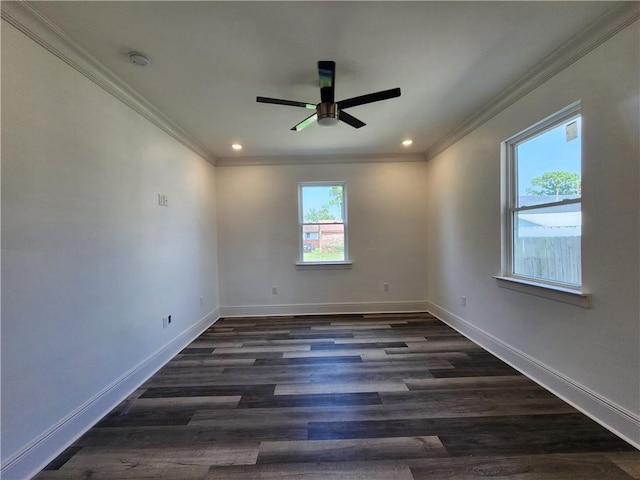 spare room with ceiling fan, crown molding, and dark wood-type flooring