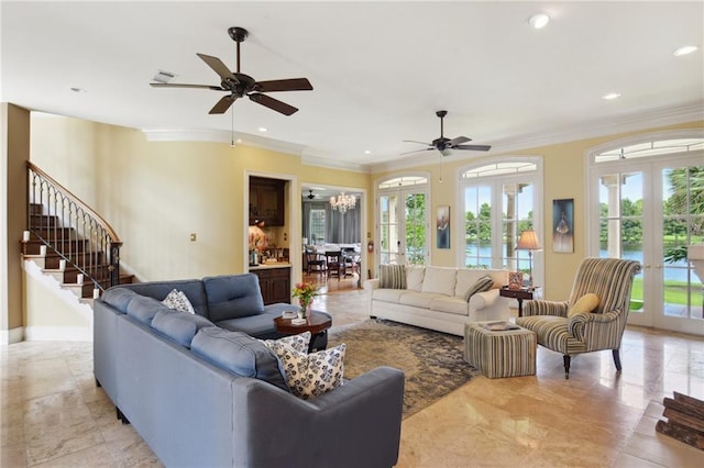 living room with french doors, ceiling fan, and a healthy amount of sunlight