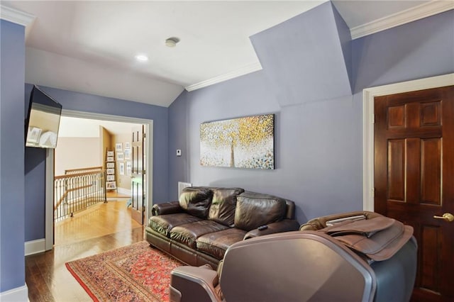 living room with crown molding, lofted ceiling, and dark wood-type flooring