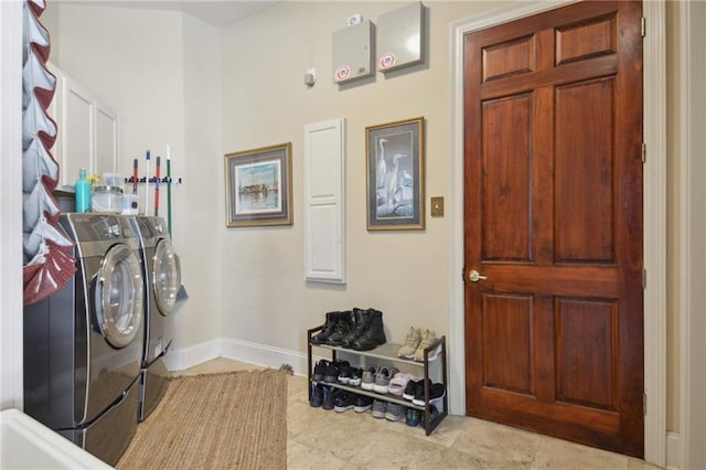 laundry area featuring washing machine and clothes dryer