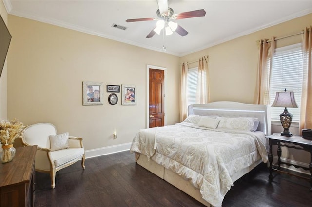 bedroom featuring ceiling fan, crown molding, and dark wood-type flooring