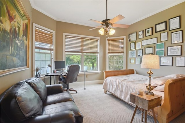 bedroom featuring ceiling fan, crown molding, and light carpet