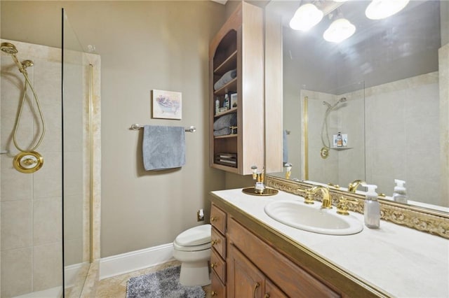 bathroom featuring tiled shower, vanity, tile patterned floors, and toilet