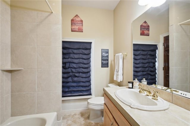 bathroom featuring tile patterned floors, vanity, and toilet