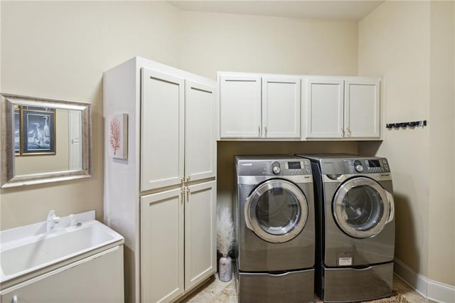 laundry room with cabinets and independent washer and dryer