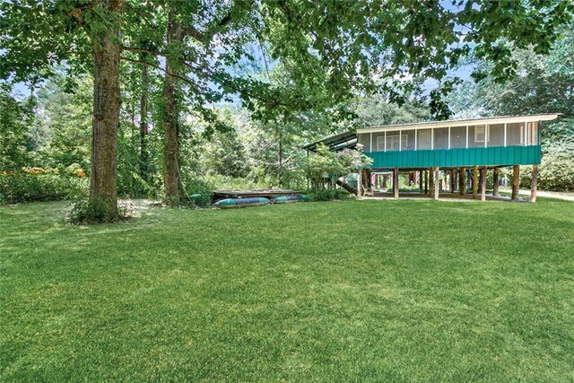 view of yard featuring a sunroom