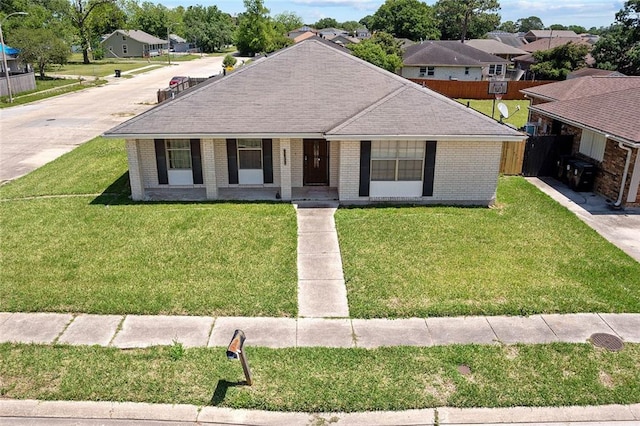 ranch-style home featuring a front lawn