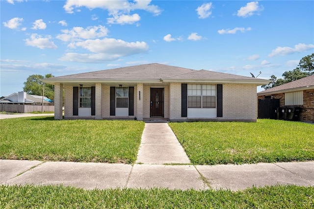 ranch-style house with a front lawn