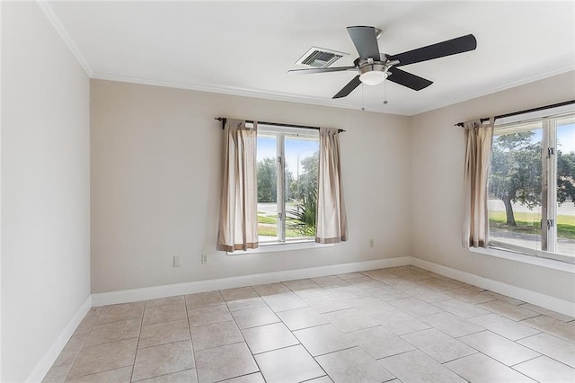 tiled spare room featuring ornamental molding and ceiling fan