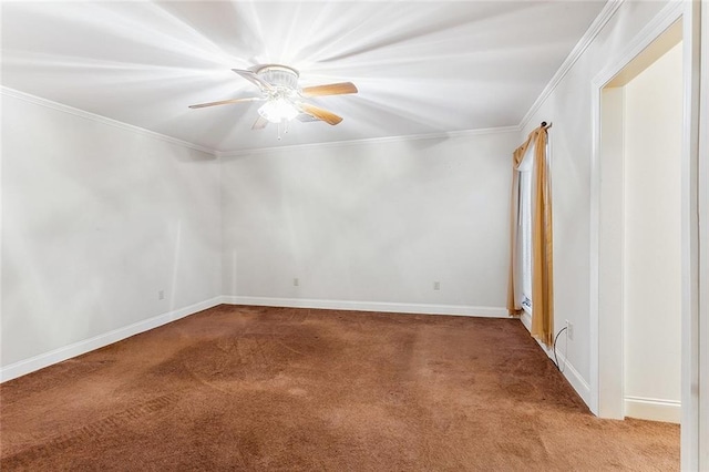 carpeted spare room with ceiling fan and crown molding