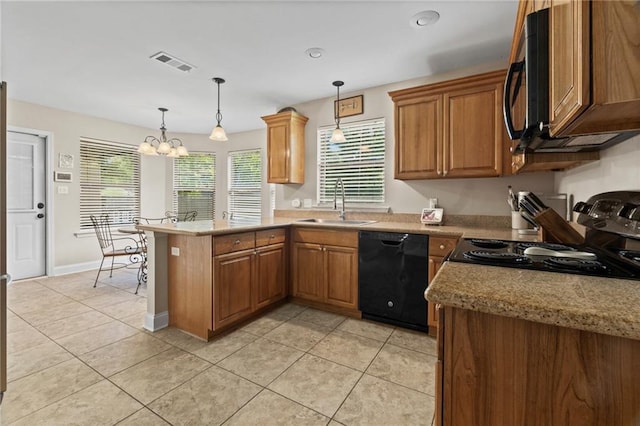 kitchen with visible vents, a peninsula, a sink, black appliances, and a chandelier
