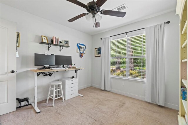 office space featuring visible vents, baseboards, carpet, and a ceiling fan