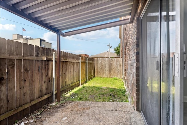 view of yard featuring a fenced backyard and a patio