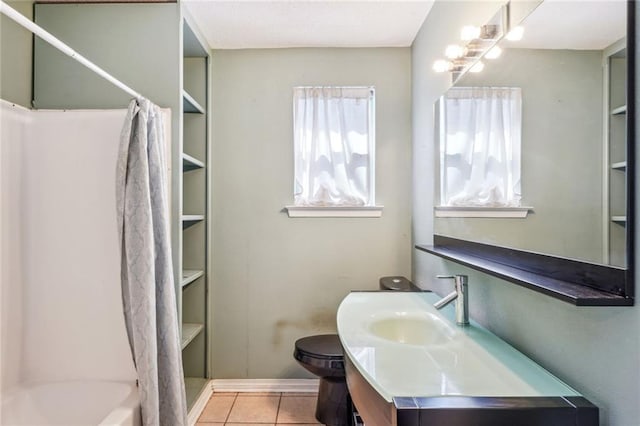 bathroom with tile patterned floors, toilet, vanity, and a shower with shower curtain