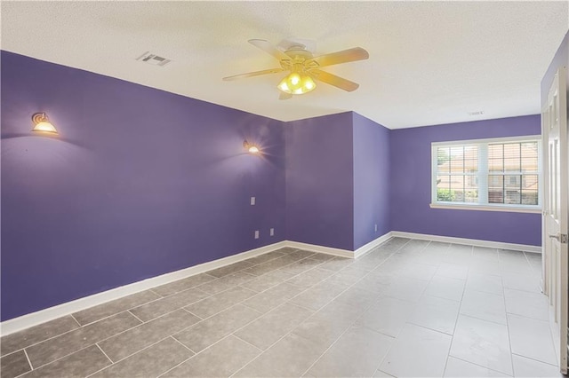 tiled empty room with ceiling fan