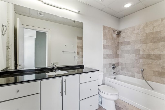 835 Julia St Unit 8, New Orleans, LA 70113 - full bath with toilet, bathtub / shower combination, vanity, tile patterned floors, and a drop ceiling