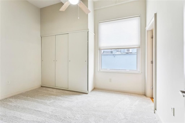 835 Julia St Unit 8, New Orleans, LA 70113 - unfurnished bedroom with carpet, a closet, ceiling fan, and baseboards