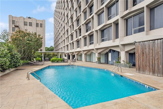 view of swimming pool with a patio