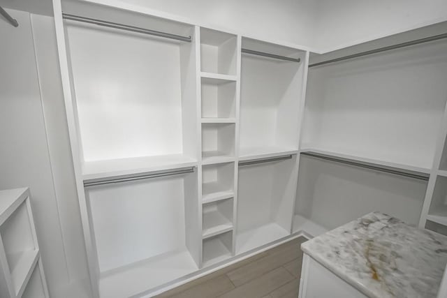 walk in closet featuring dark wood-type flooring