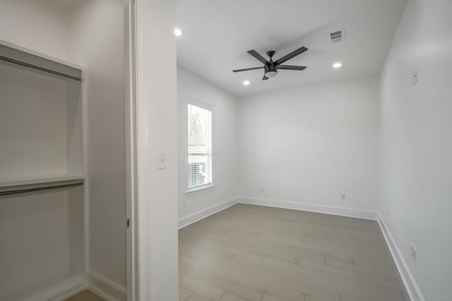 interior space with ceiling fan and light hardwood / wood-style floors