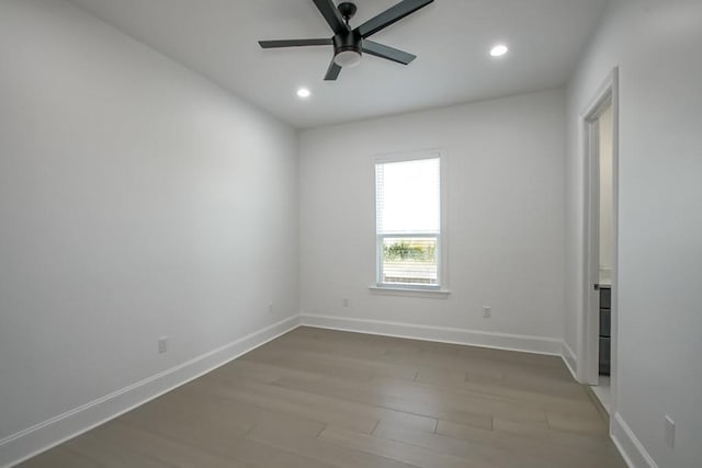 spare room featuring ceiling fan and wood-type flooring