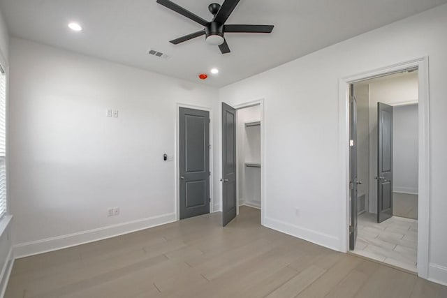 unfurnished bedroom featuring ceiling fan and hardwood / wood-style floors