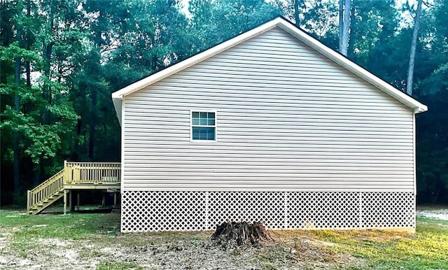 view of property exterior with a deck