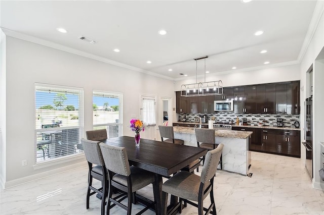 dining room with crown molding