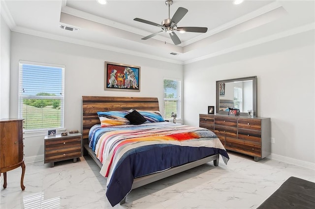 bedroom featuring ceiling fan, a raised ceiling, and ornamental molding