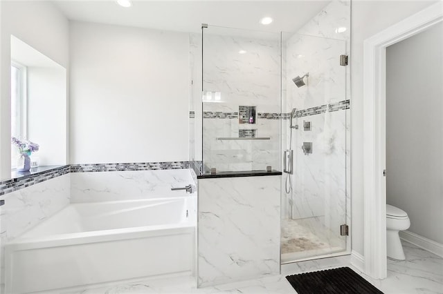 bathroom with toilet and shower with separate bathtub