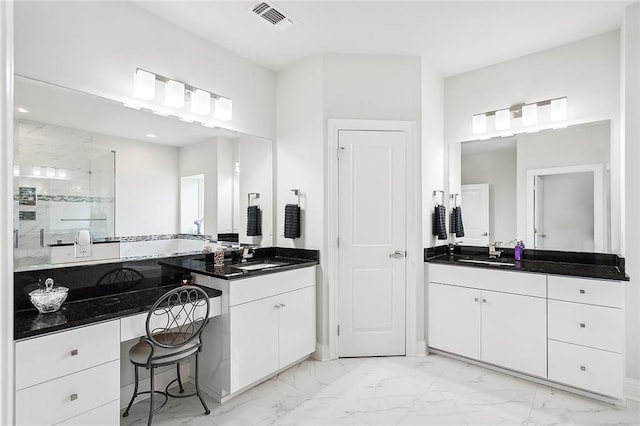 bathroom featuring vanity and a shower with shower door