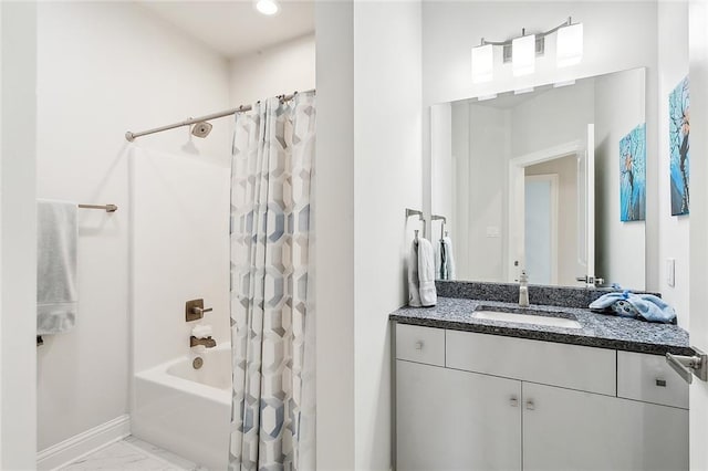 bathroom with shower / bath combo with shower curtain and vanity