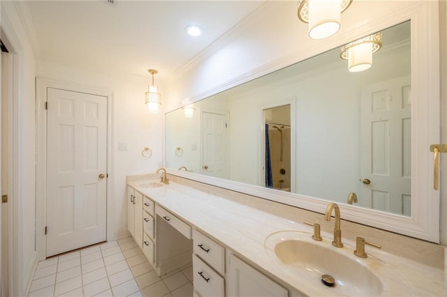 bathroom featuring vanity, tile patterned floors, and crown molding