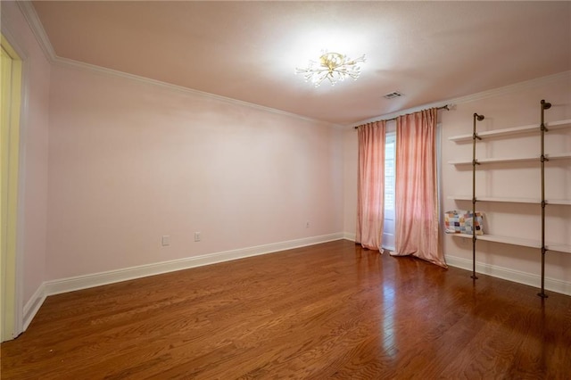 unfurnished room featuring dark wood-type flooring and crown molding