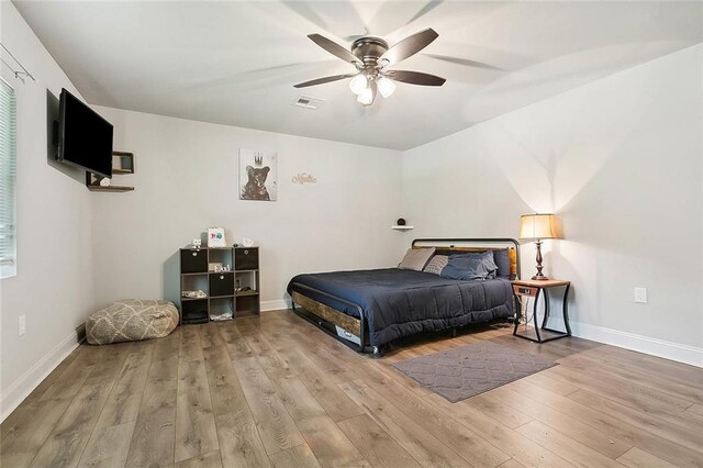 bedroom featuring ceiling fan and hardwood / wood-style floors