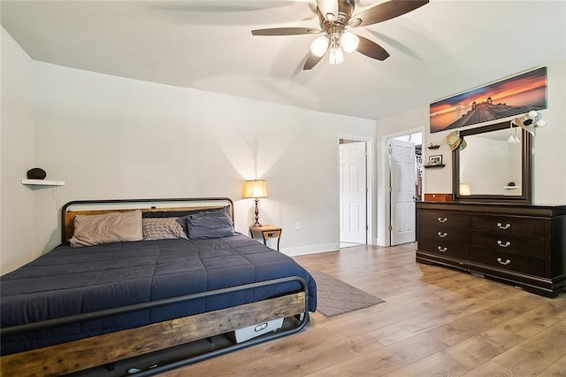 bedroom featuring ceiling fan and light hardwood / wood-style flooring