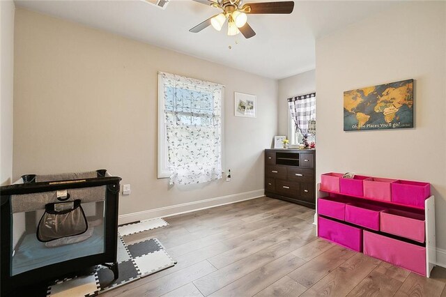 interior space featuring ceiling fan and light wood-type flooring