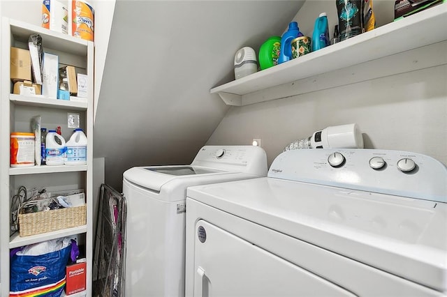 laundry room with washing machine and clothes dryer