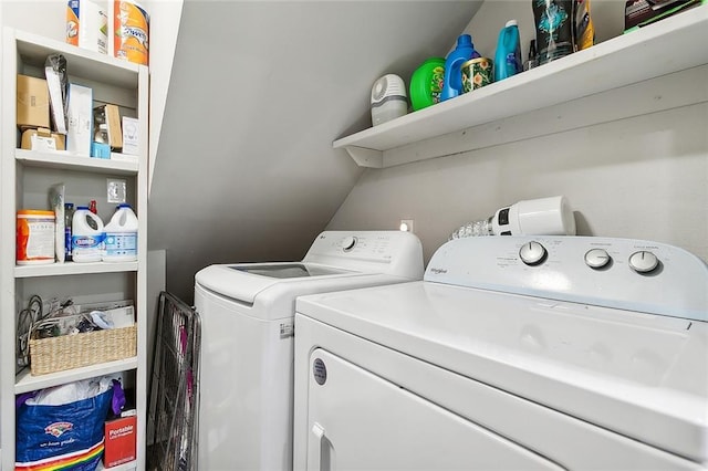 washroom with laundry area and washer and dryer