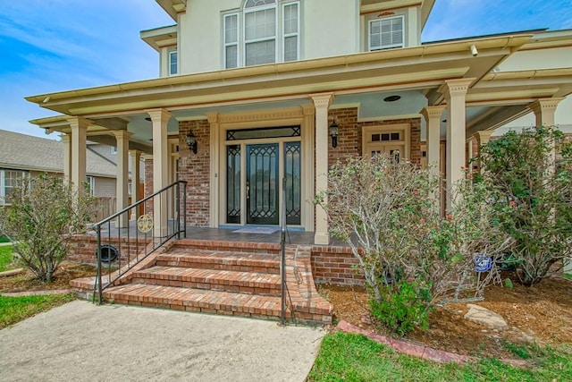 entrance to property with a porch