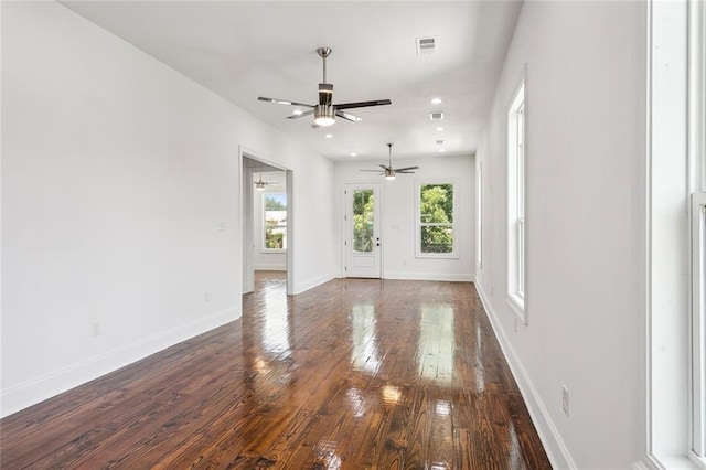 spare room with ceiling fan and wood-type flooring