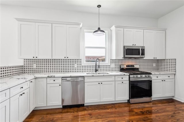 kitchen with sink, stainless steel appliances, white cabinets, and dark hardwood / wood-style floors