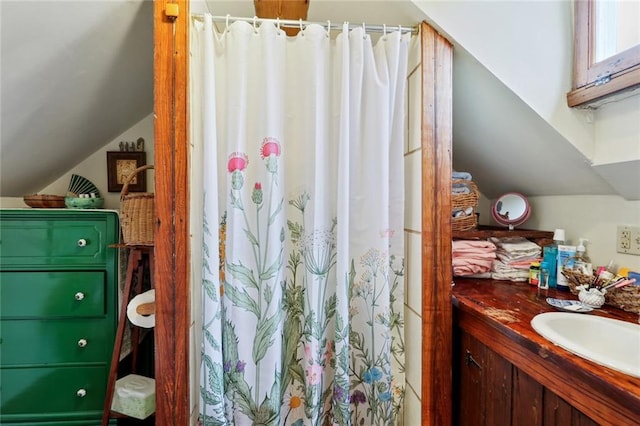 bathroom featuring a shower with shower curtain and vanity