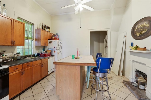 kitchen with white dishwasher, a center island, ceiling fan, ornamental molding, and sink