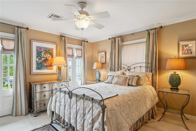 bedroom with carpet, crown molding, and ceiling fan